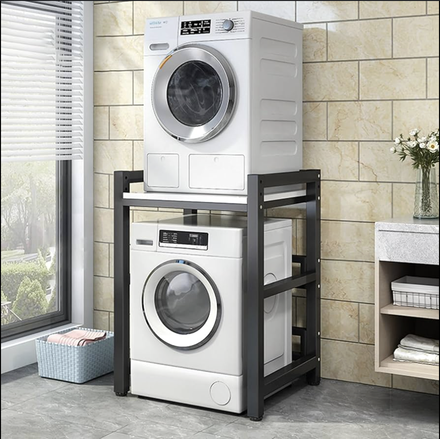 Technician repairing a stainless steel oven in a modern kitchen